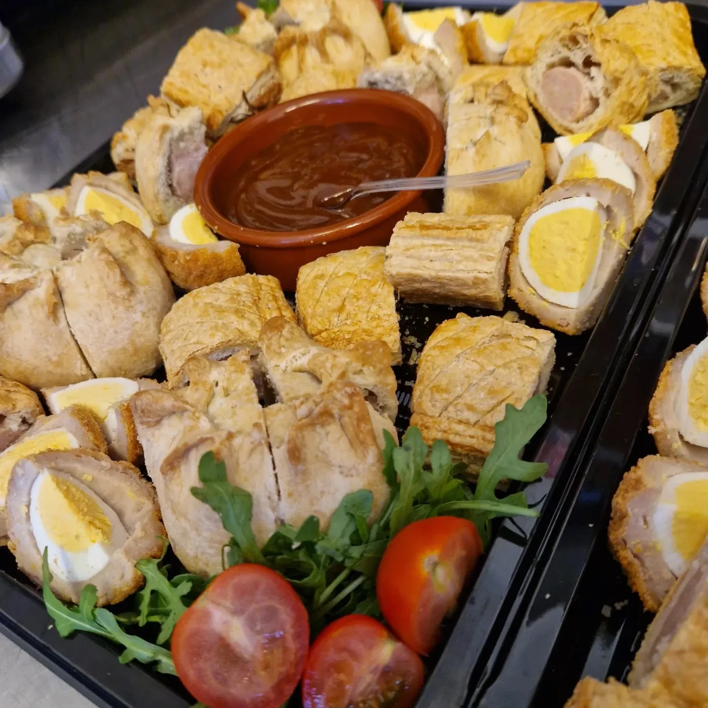 A mixed buffet platter with sandwiches, eggs and savouries