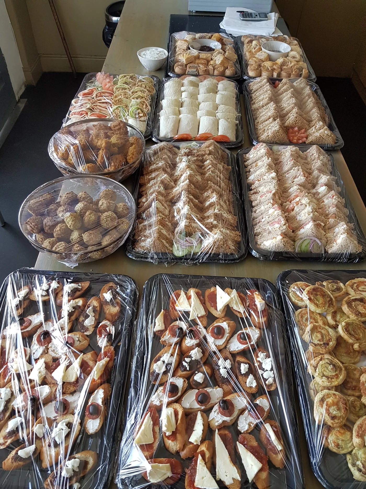 A catering spread of sandwiches, savouries and sweet bites from Slice